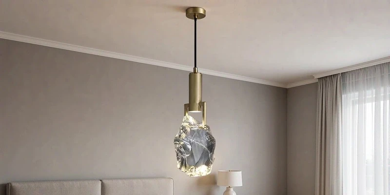 Crystal chandelier beside a bed Crystal chandelier beside a bed